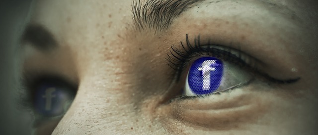 woman with facebook logo in eye. 