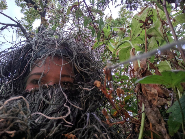 Selfie of Therese as she is dressed as a bush.