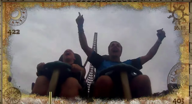 Samuel Kempf celebrating catching a falling phone on a roller coaster.