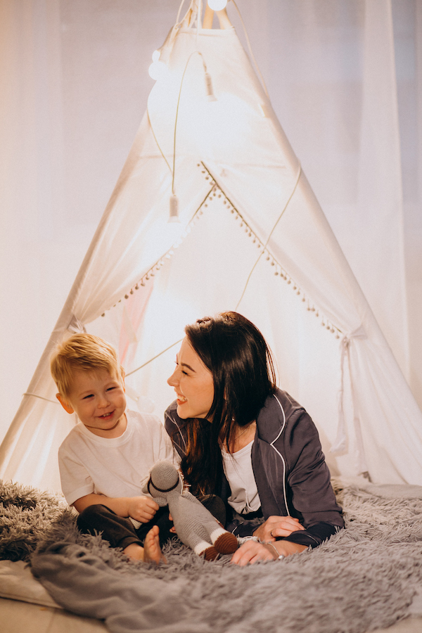mom and kid in a tent