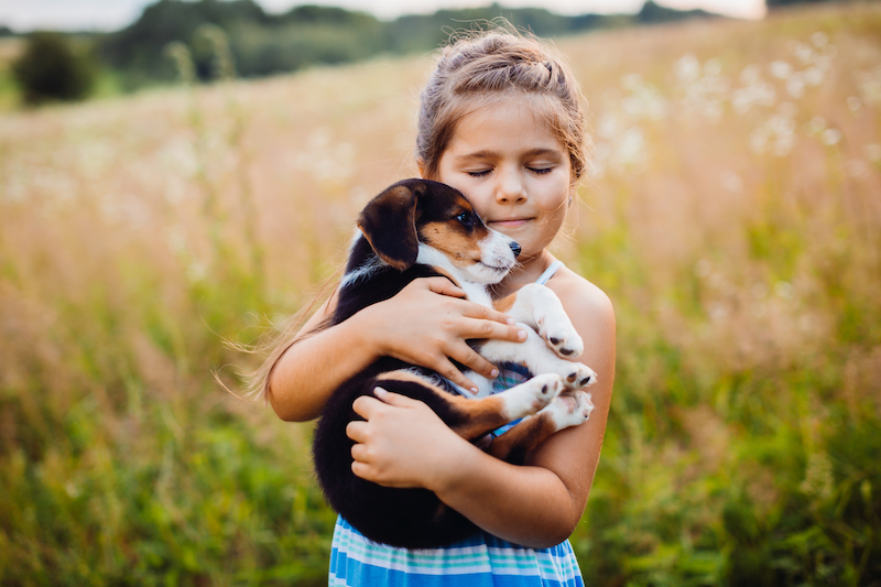 Kid holding a puppy