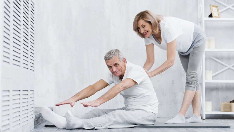 Old couple doing yoga